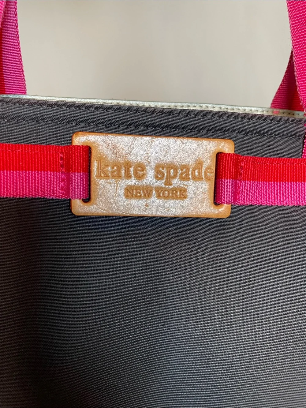 kate spade black tote with pink and red trim